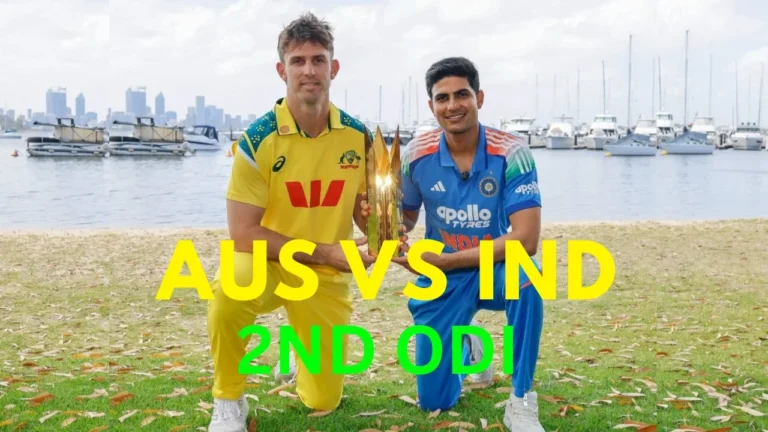 কোহলি টানা দ্বিতীয় ডাক: ভারত বনাম অস্ট্রেলিয়া দ্বিতীয় ODI 1 Australian captain Mitchell Marsh and Indian captain Shubman Gill posing with the ODI trophy on a grassy bank near a river or harbor with boats and a city skyline in the background, ahead of the Australia vs India 2nd ODI. The text reads "AUS VS IND 2ND ODI".